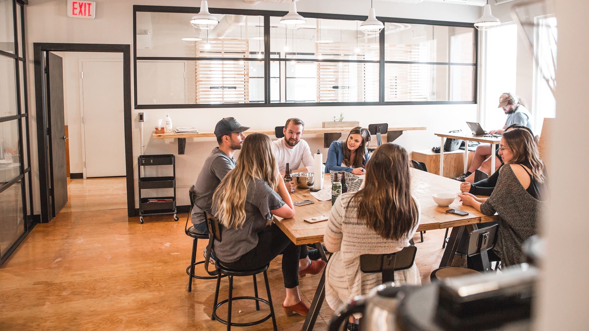 a group of people sitting at a desk